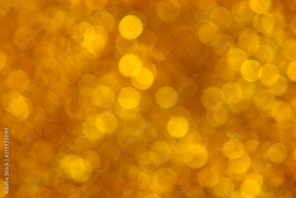 Golden glitter texture with tranparent bokeh circles, scattered around Golden glitter texture with tranparent bokeh circles, scattered around