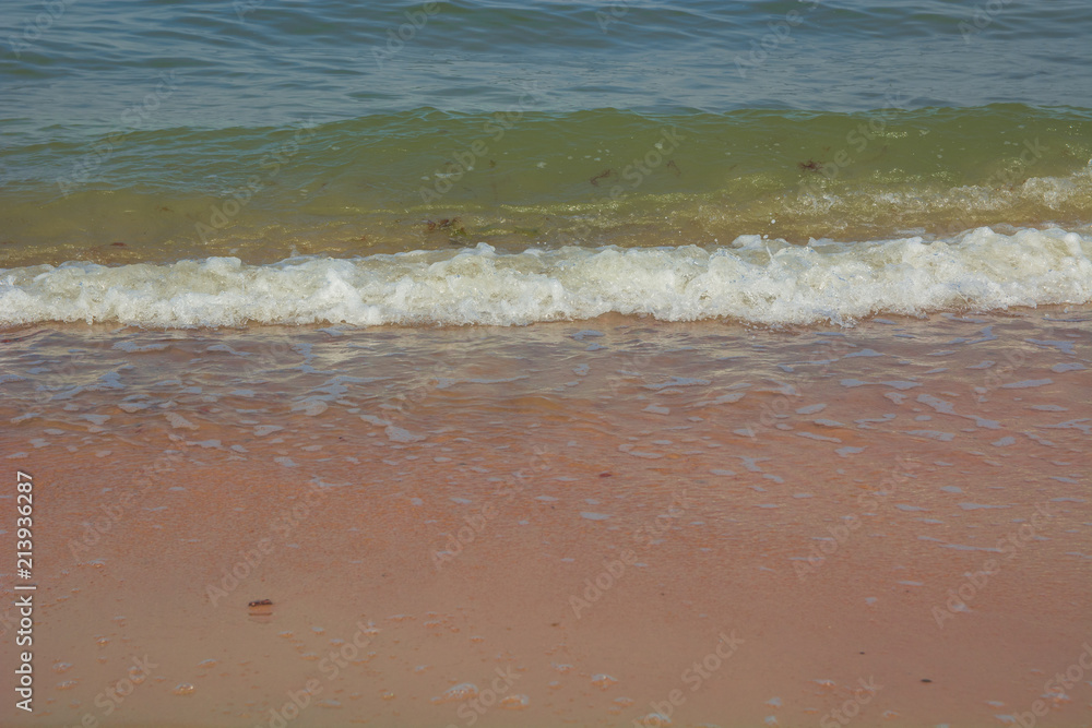 Sea soft wave on the white sand beach close up Sea soft wave on the white sand beach close up