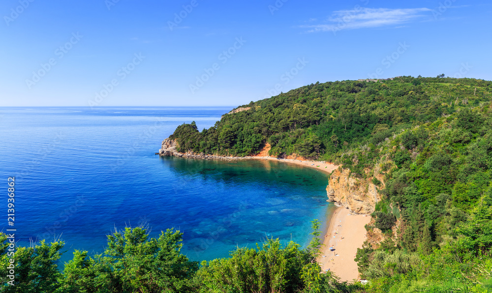 View from above on Adriatic sea coastline and Mogren beach at Montenegro, nature landscape, vacations to the summer paradise View from above on Adriatic sea coastline and Mogren beach at Montenegro, nature landscape, vacations to the summer paradise