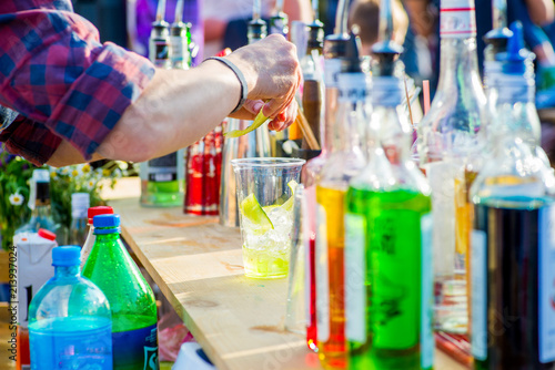 barman prepares lemonade on the street