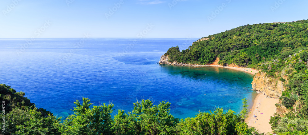 View from above on Adriatic sea coastline and Mogren beach at Montenegro, nature landscape, vacations to the summer paradise, panoramic view
