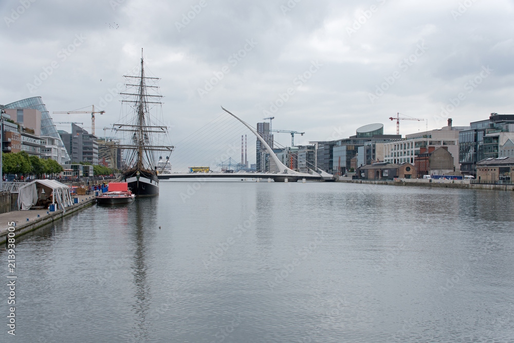 Old sailing ship on River Liffey, Samuel Beckett Bridge and the CCD, Dublin, Ireland