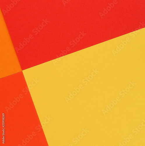 Abstract geometric paper background. Red  orange  yellow trend colors.Background pastel colors. Minimal concept. Flat lay  Top view. Copy space