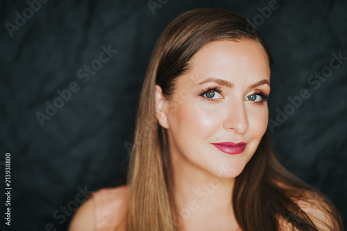 Young beautiful woman studio shot, pretty girl with bright make up