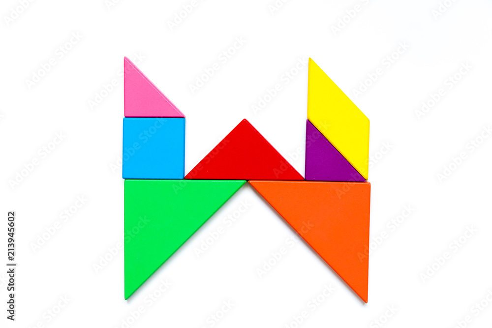 Color tangram puzzle in english alphabet w shape on white background Color tangram puzzle in english alphabet w shape on white background