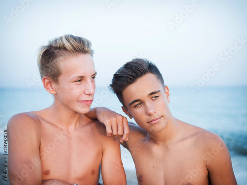 two young friends on the beach