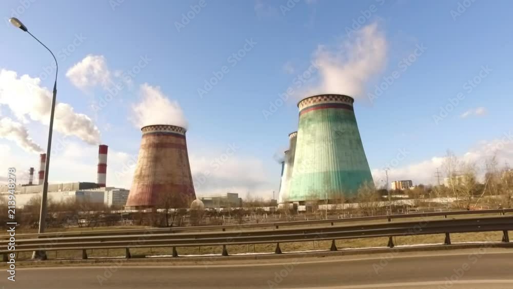 A shot from a car passing nuclear power plants. A shot from a car passing nuclear power plants.
