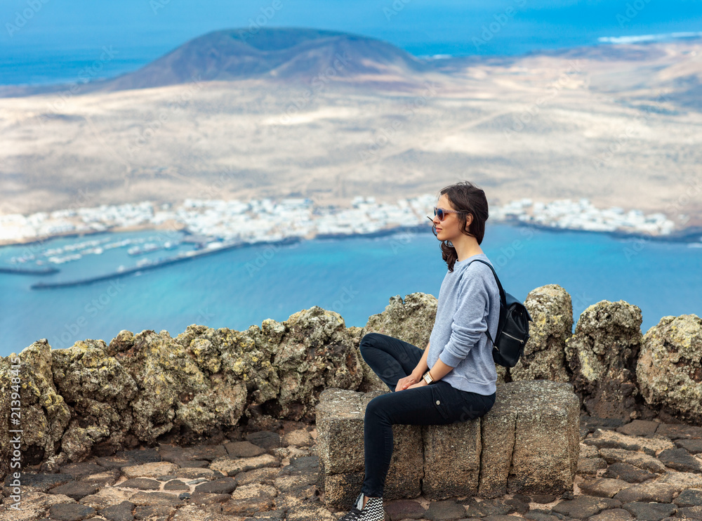 Traveler woman enjoying at viewpoint on island Traveler woman enjoying at viewpoint on island