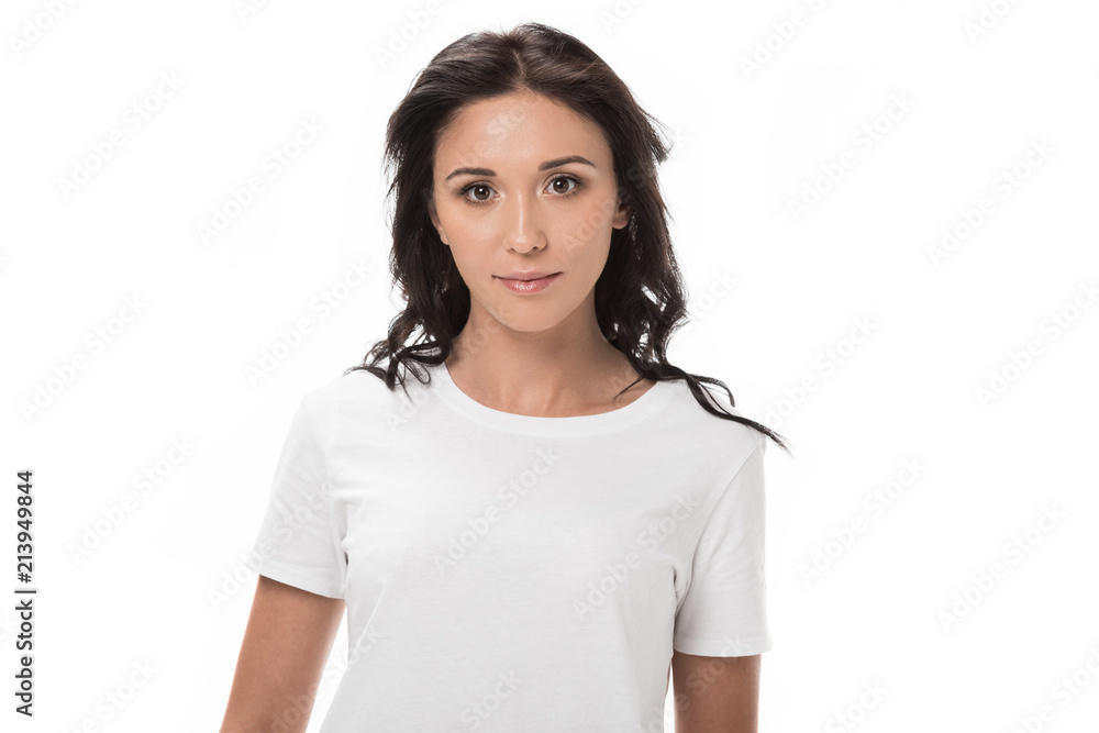 portrait of pensive young woman in white shirt looking at camera isolated on white portrait of pensive young woman in white shirt looking at camera isolated on white