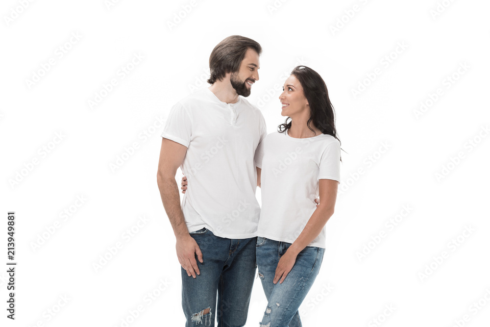 portrait of smiling couple hugging and looking at each other isolated on white portrait of smiling couple hugging and looking at each other isolated on white