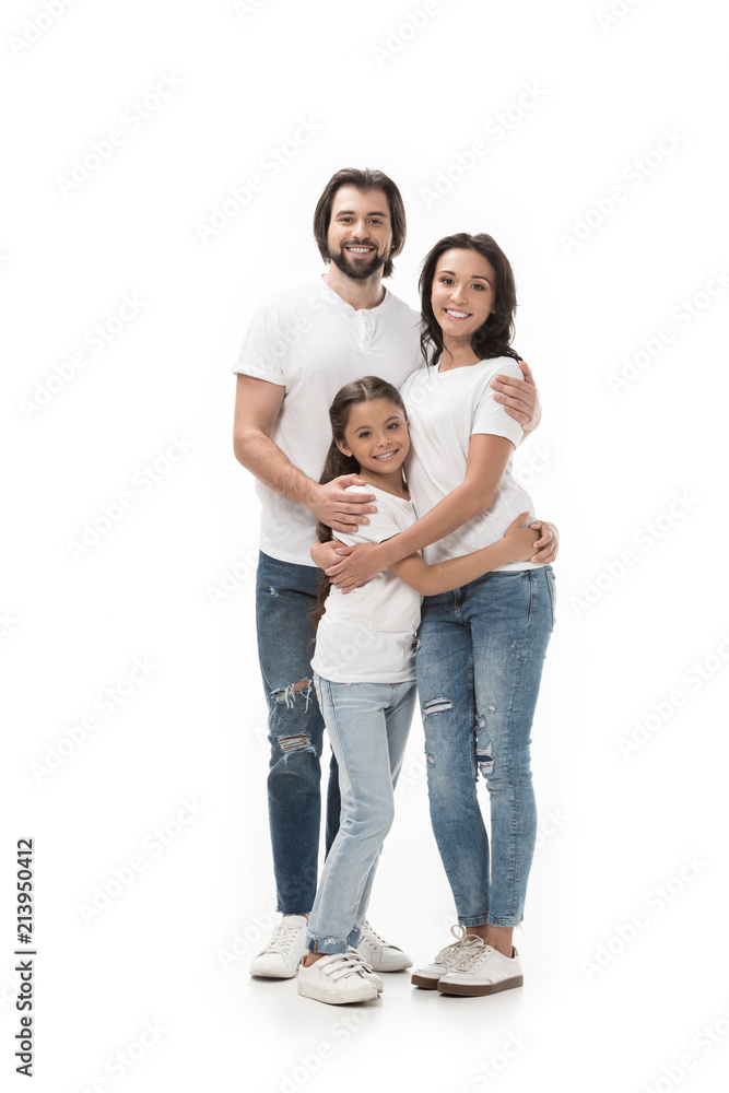 happy family in white shirts and jeans looking at camera isolated on white happy family in white shirts and jeans looking at camera isolated on white
