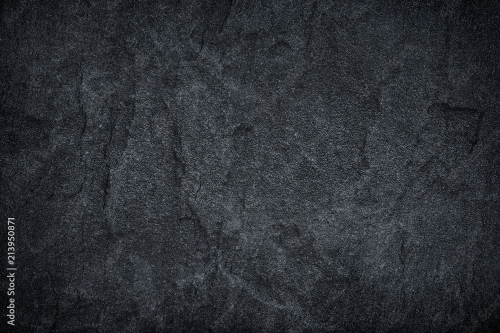 Obraz premium Dark grey black slate stone background or texture.