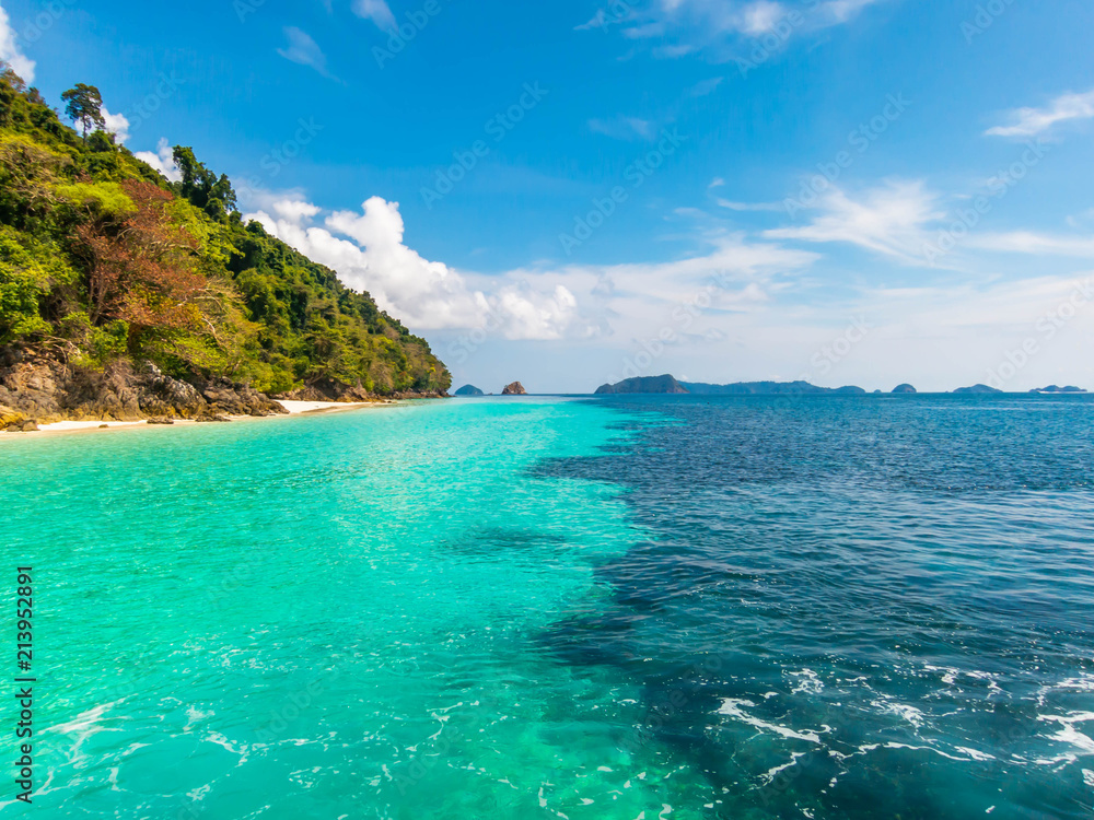 Wonderful seascape. Clear turquoise sea, forest mountain and blue sky. Wonderful seascape. Clear turquoise sea, forest mountain and blue sky.