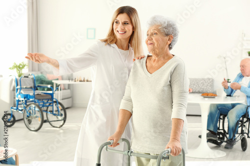 Senior woman with walkers a...