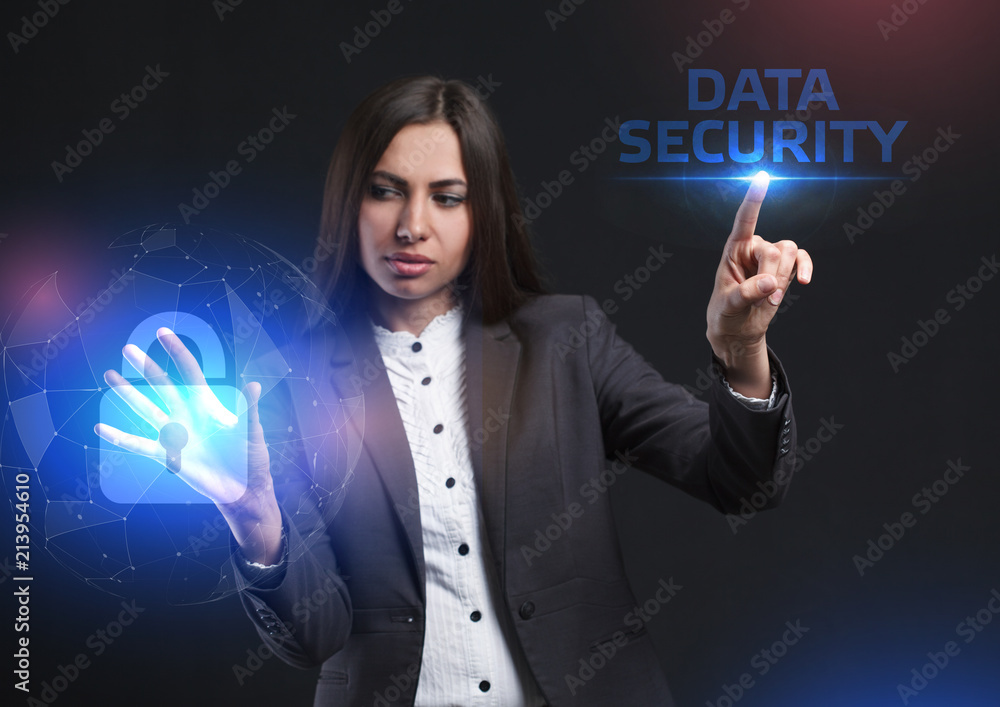 The concept of business, technology, the Internet and the network. A young entrepreneur working on a virtual screen of the future and sees the inscription: Data security The concept of business, technology, the Internet and the network. A young entrepreneur working on a virtual screen of the future and sees the inscription: Data security