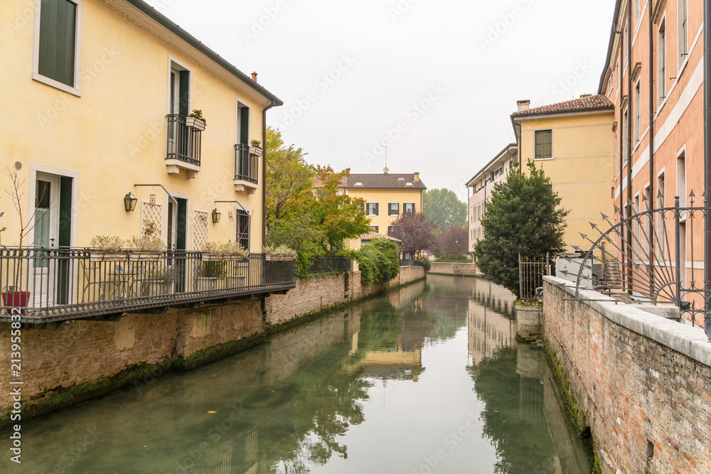 Fototapeta premium Scenic of treviso town with calnal scene