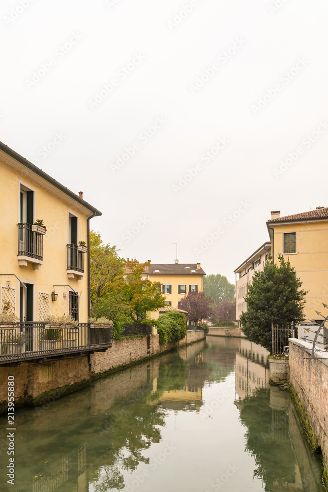 Scenic of treviso town with calnal scene