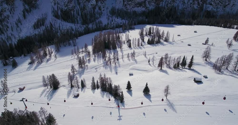 Aerial, ski tracks and a cableway in winter Alps in Italy Aerial, ski tracks and a cableway in winter Alps in Italy