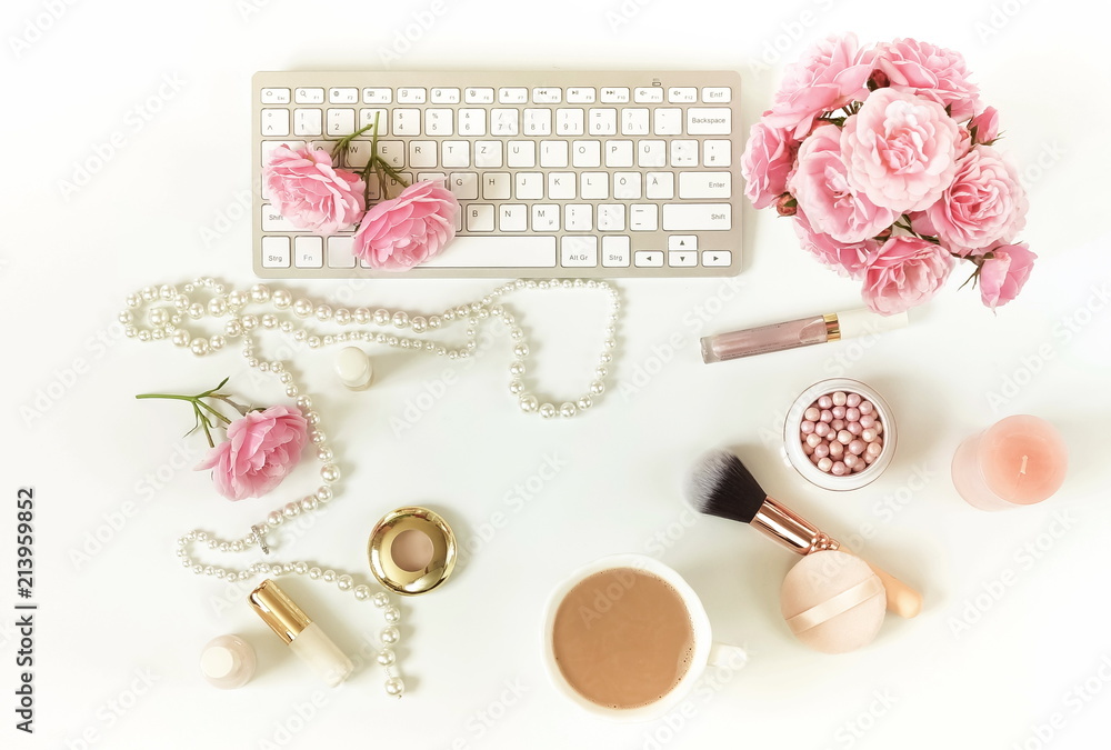 Flat lay, top view office feminine desk, female make up accessories, workspace with laptop and bouquet roses.Beauty blog concept.Copy space Flat lay, top view office feminine desk, female make up accessories, workspace with laptop and bouquet roses.Beauty blog concept.Copy space