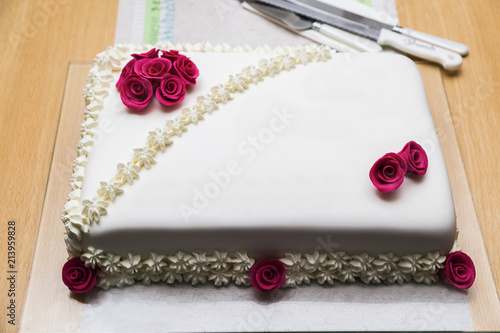 Wedding cake with decoretion from cream roses photo