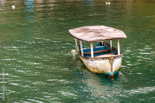 Old fishing boat on the shores of Golfito, Costa Rica.  Day to day life in the small village of Golfito, Costa Rica. photo