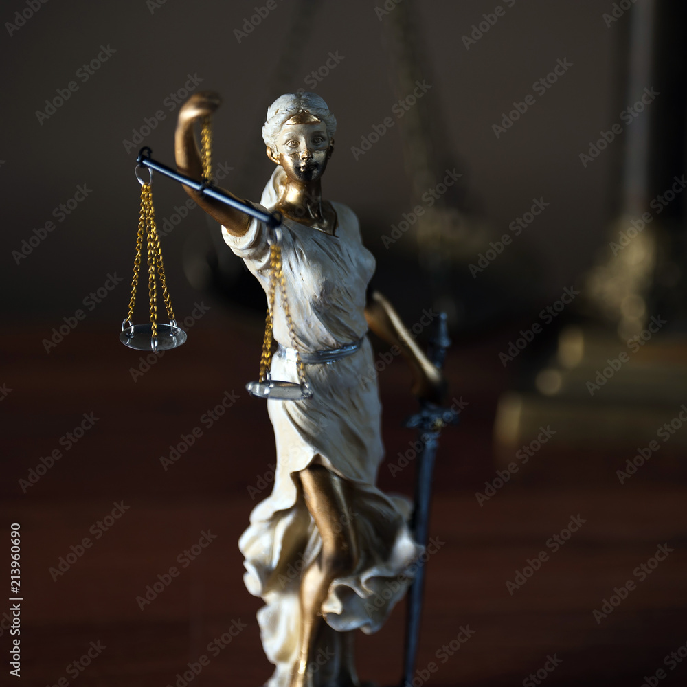 Themis with scales in lawyers office. Statue of blind goddess Themis with scales in lawyers office. Statue of blind goddess