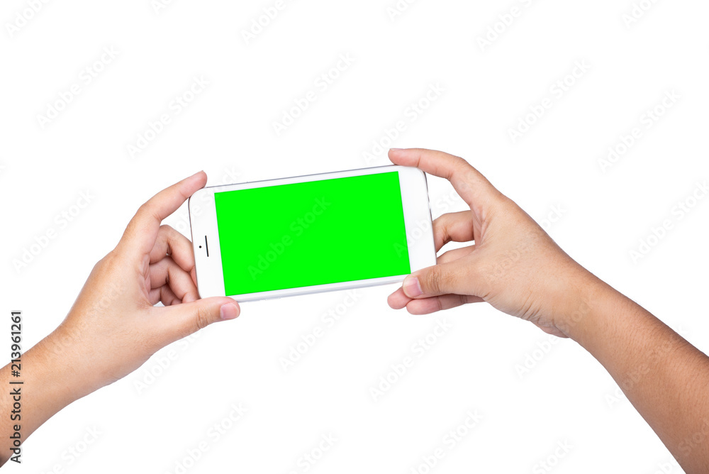 Hand holding a modern mobile smart phone with blank green screen isolated copy space on white background Hand holding a modern mobile smart phone with blank green screen isolated copy space on white background