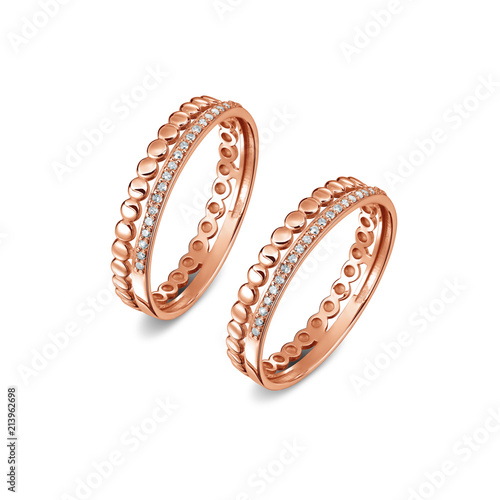 A pair of luxury rose gold rings with diamonds on the white background, isolated, golden rings isolated