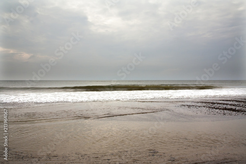 North Sea beach in Denmark at cloudy day. photo