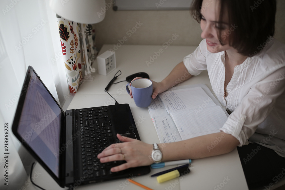 thoughtful tired woman working at computer at home thoughtful tired woman working at computer at home