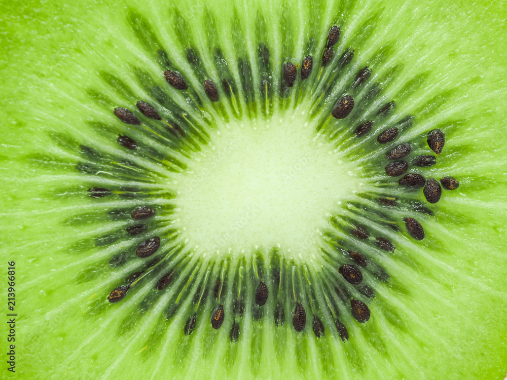 Slice of fresh juicy delicious and healthy kiwi fruit, close up Slice of fresh juicy delicious and healthy kiwi fruit, close up
