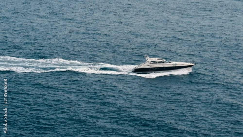 motorboat sails on sea dissecting waves motorboat sails on sea dissecting waves