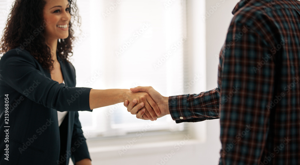 Businesswoman shaking hand with a business partner