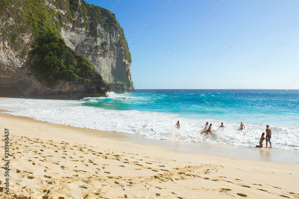 Pristine tropical beach for Asian and Pacific travel concept.  Warm summer sun and blue water.  Vacation in the islands.
