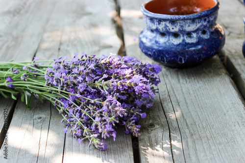 Fototapeta Naklejka Na Ścianę i Meble -  A bouquet of fresh cut lavender with tableware Gzhel