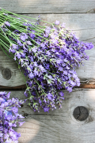 Fototapeta Naklejka Na Ścianę i Meble -  A bouquet of fresh cut lavender with tableware Gzhel