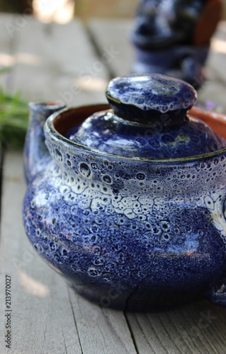 Fototapeta Naklejka Na Ścianę i Meble -  A bouquet of fresh cut lavender with tableware Gzhel