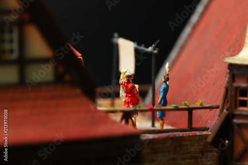 Wallpaper Mural Miniature figure model scene of housekeeper do laundry work on rooftop house model. Torontodigital.ca