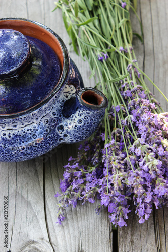 Fototapeta Naklejka Na Ścianę i Meble -  A bouquet of fresh cut lavender with tableware Gzhel