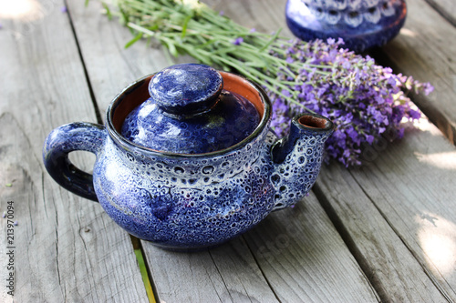 Fototapeta Naklejka Na Ścianę i Meble -  A bouquet of fresh cut lavender with tableware Gzhel