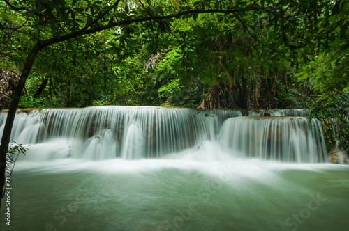 Beautiful and Breathtaking green waterfall at the tropical rain forest, Erawan's waterfall, Located Kanchanaburi Province, Thailand © peangdao