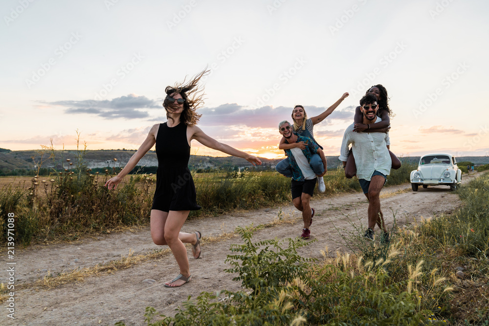Friends having fun in nature and running Friends having fun in nature and running