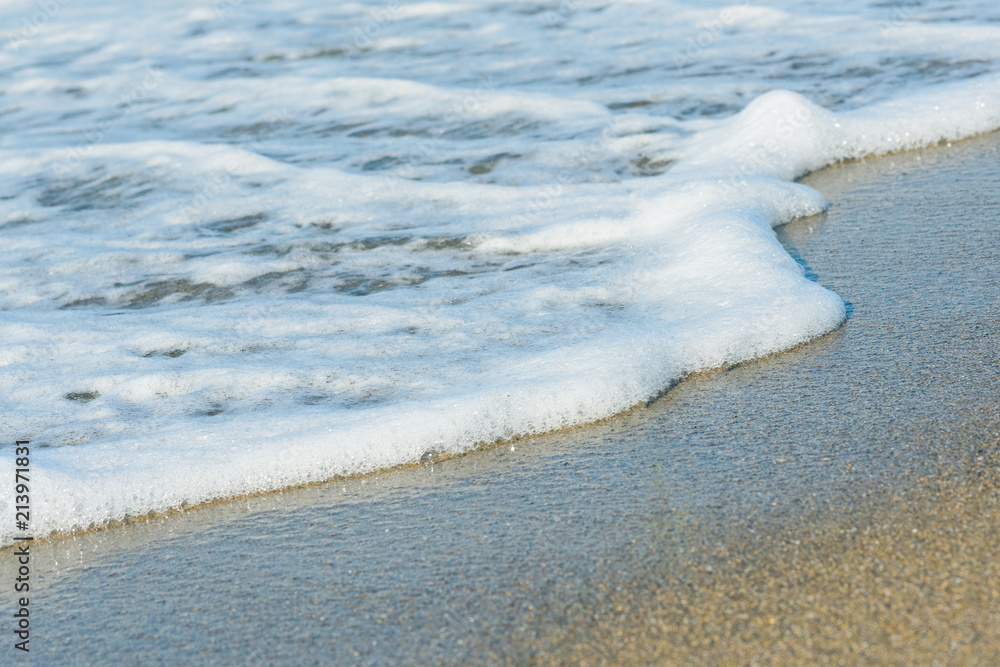 Sea foam on the sand
