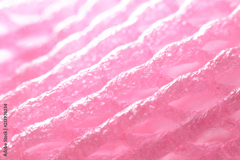 Macro closeup soft pink fruit net with light shine on Macro closeup soft pink fruit net with light shine on