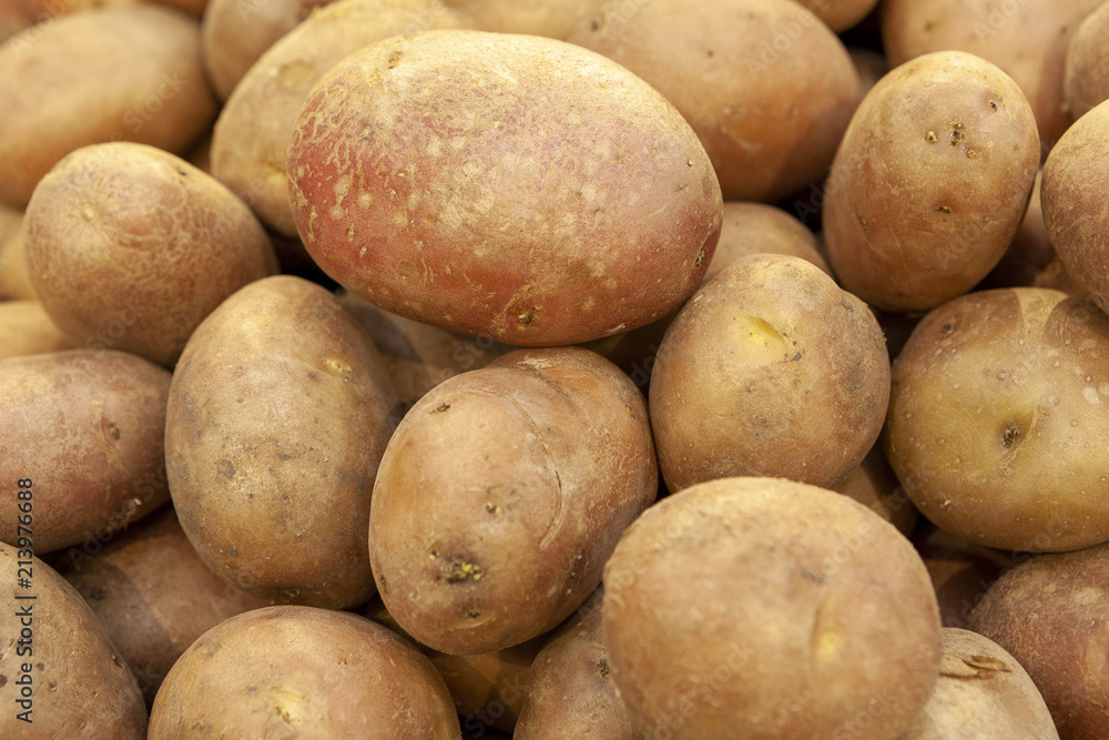 Pile of fresh organic potatoes top view close up. Pile of fresh organic potatoes top view close up.