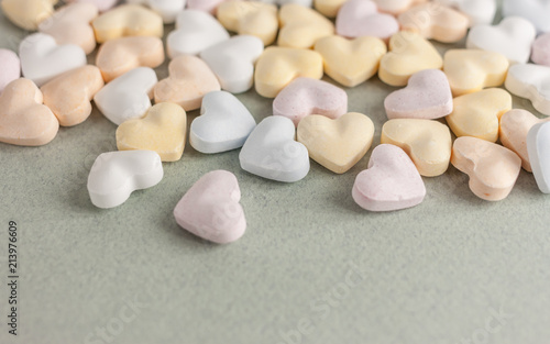 colorful candy hearts on craft background