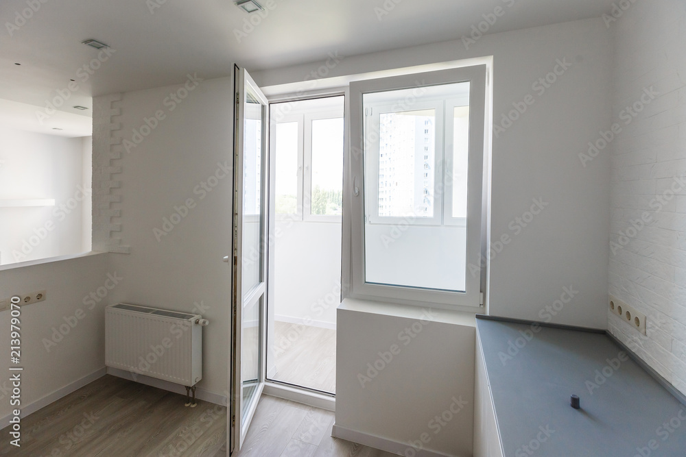 Empty tiled kitchen with dish stainless steel appliances Empty tiled kitchen with dish stainless steel appliances