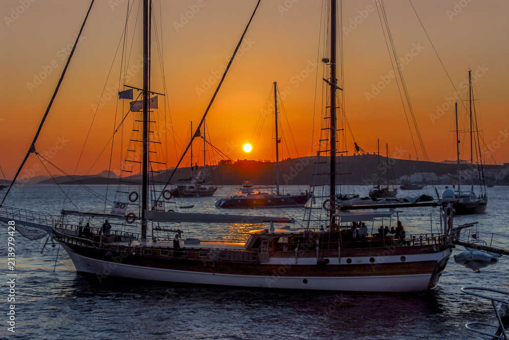 Bodrum, Turkey, 23 October 2010: Bodrum Cup Races, Gulet Wooden Sailboats with Sunset Bodrum, Turkey, 23 October 2010: Bodrum Cup Races, Gulet Wooden Sailboats with Sunset