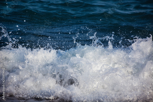 Wallpaper Mural white splashes of water in a blue sea wave Torontodigital.ca