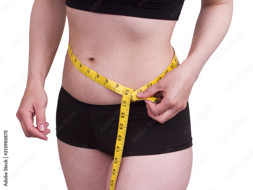 Fototapeta premium Waist measurement. There are many reasons why you might want to lose weight. overweight or obese for a long time, then you might have concerns about what the extra weight could be doing to your health